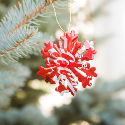 Recycled Soda Can Snowflake Ornament Hanging on Tree