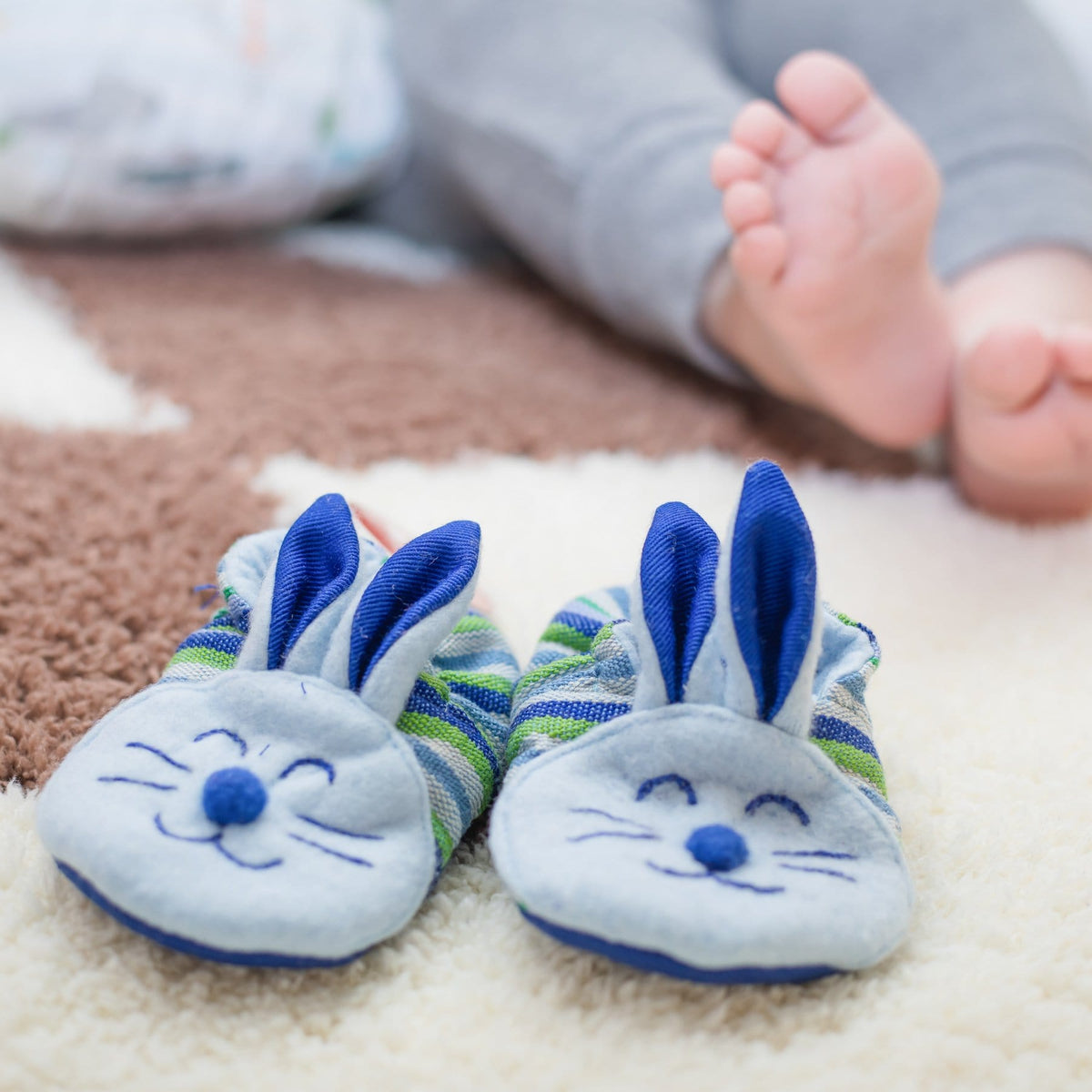 Baby Model with Blue Bunny Booties